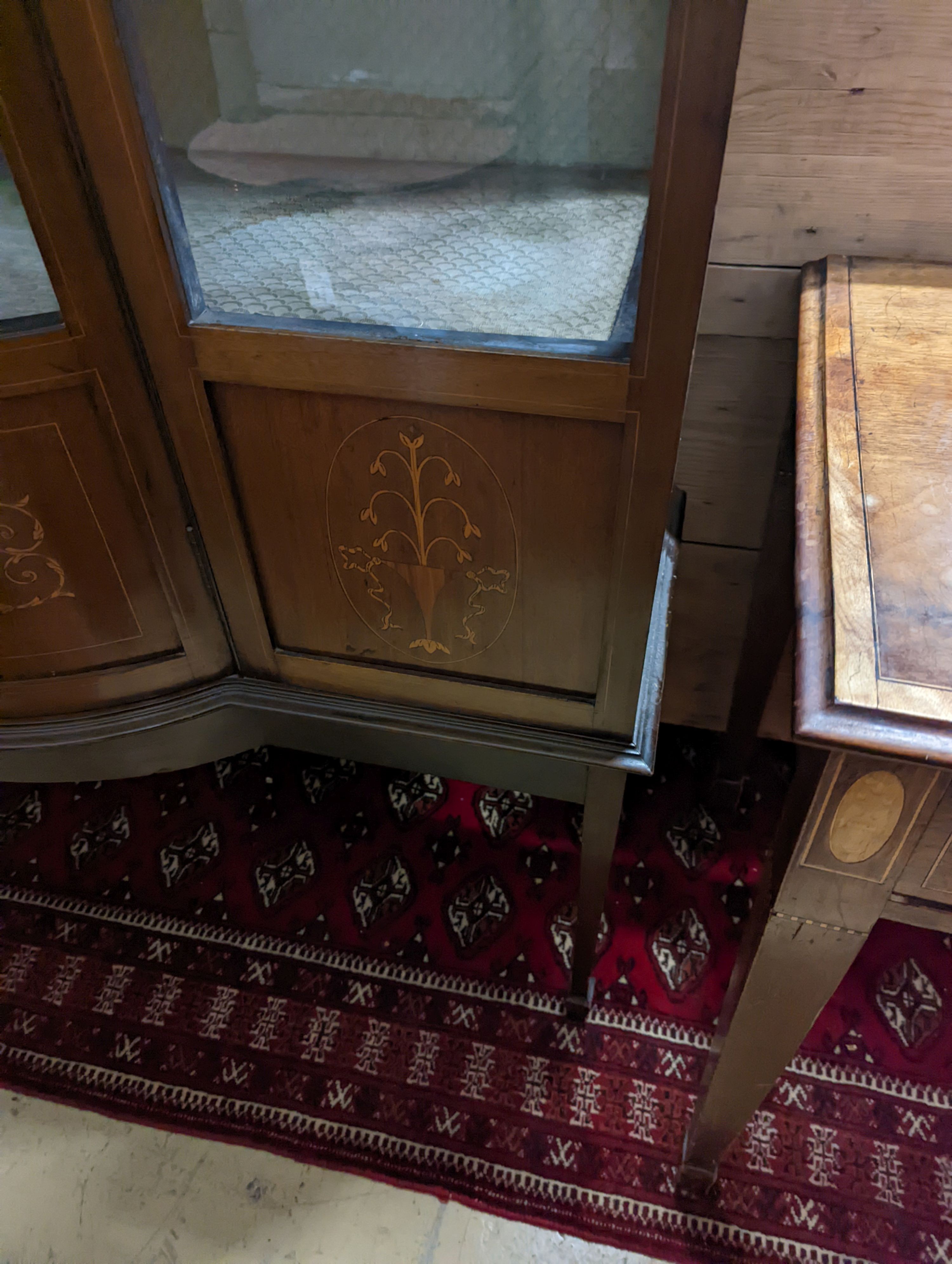 An Edwardian inlaid mahogany bow front display cabinet, width 122cm, depth 48cm, height 196cm